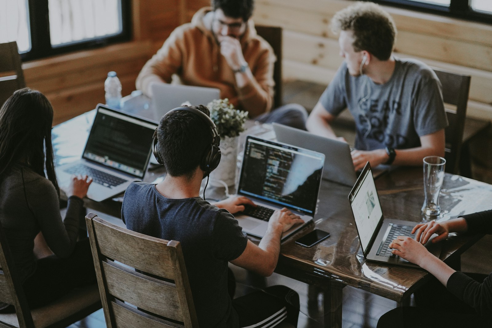 Startup team collaborating around a laptop in an office